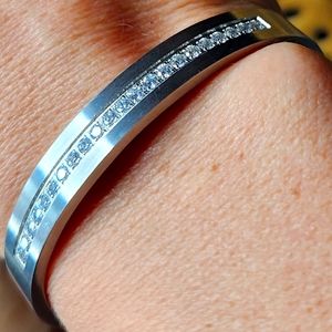 B. Tiff stainless steel CZ encrusted elegant modern silhouette clip closure cuff